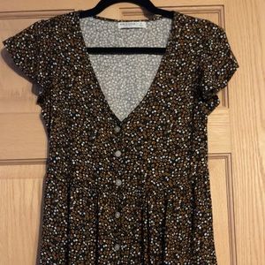 Black dress with brown and white flowers.